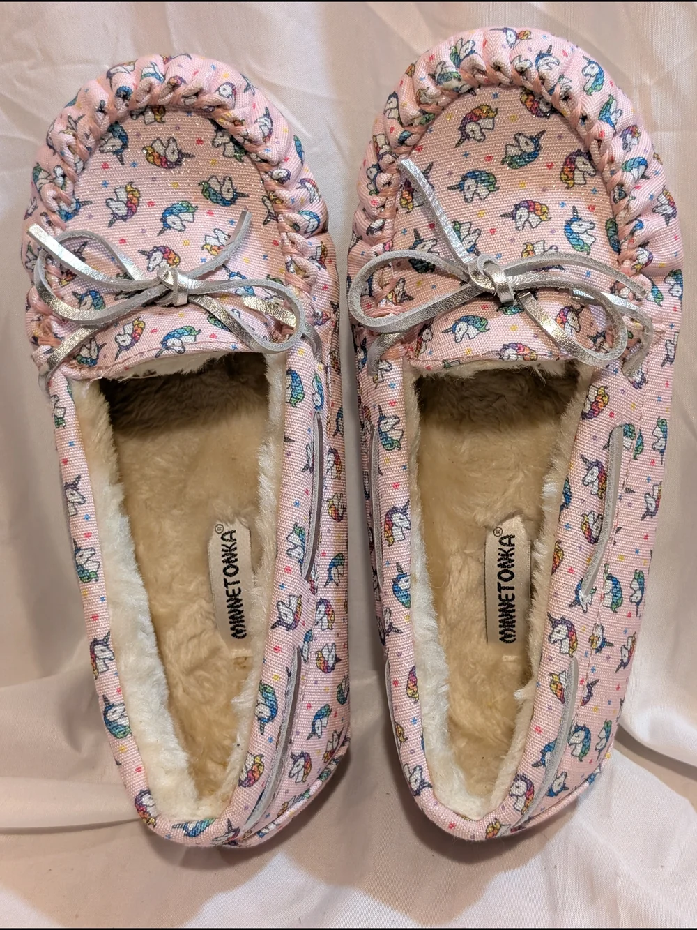 Minnetonka Pink Unicorn Print Moccasin Slippers with Silver Bow Accent